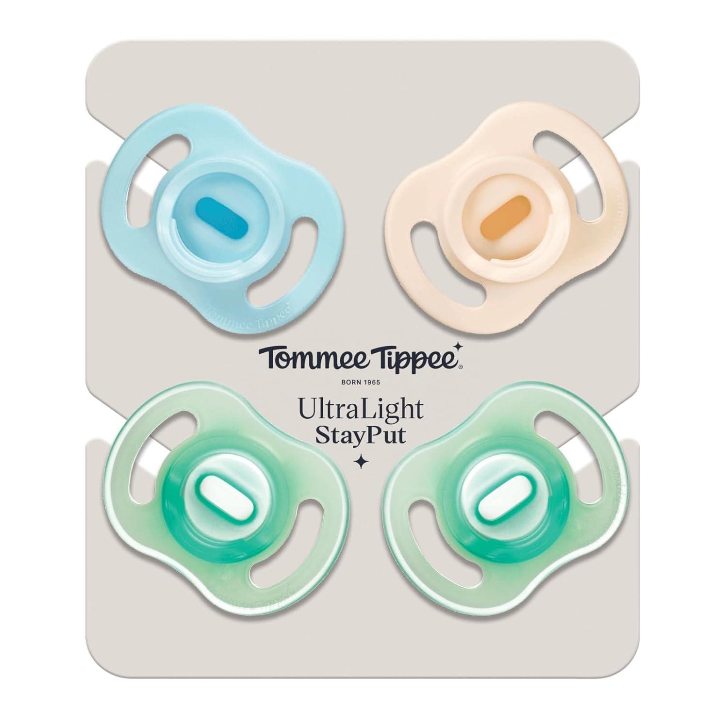 image:imageTommee Tippee Stay Put Pacifier Set Contains 2 UltraLight StayPut Glow in The Dark Pacifiers and 2 UltraLight StayPut Pacifiers 618 Months Colors May Vary OnePiece Silicone Design Pack of 4Blue Green
